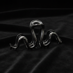 Gunmetal serpent claw clip on black velvet