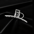 Silver Arc Shark Clip on Black Velvet